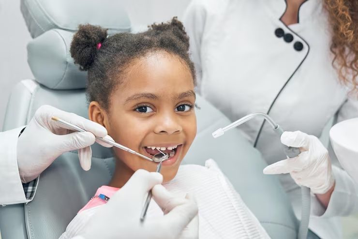 Child smiling during a dental examination